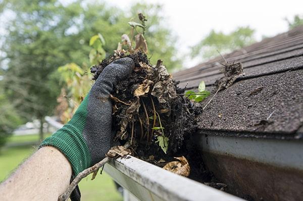 we use a combination of hand scooping and pressure washing for gutter cleaning